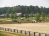 View of warmup ring with show barns in background